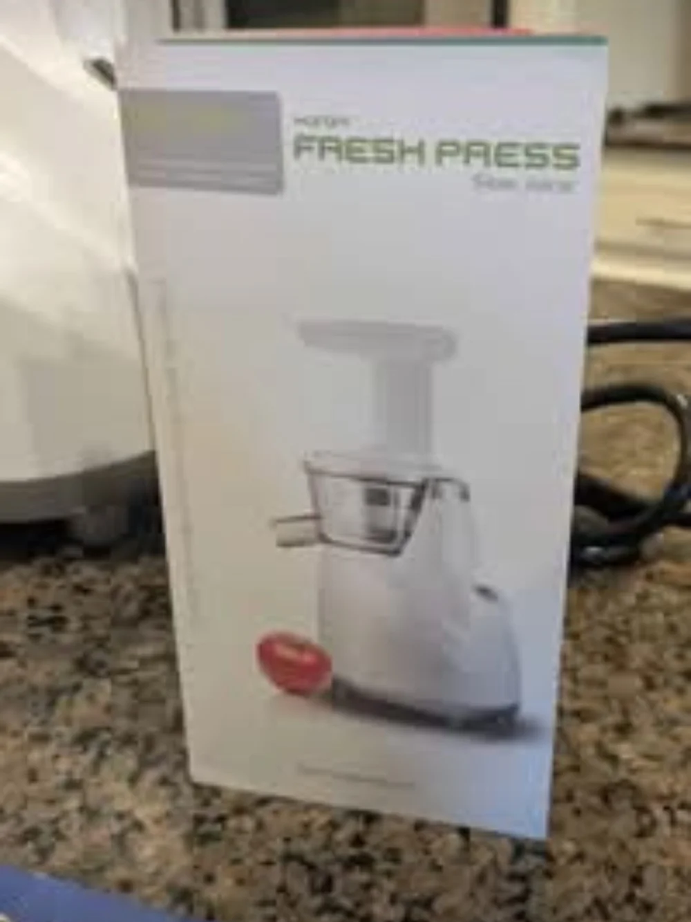 White Hurom Cold Press Juicer with Juicing Cookbooks